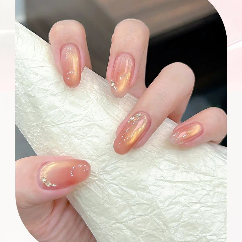 Peach gold cat-eye manicure made with the Polishelle Duo Kit